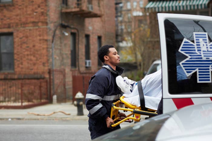 An EMT loading a patient in the truck