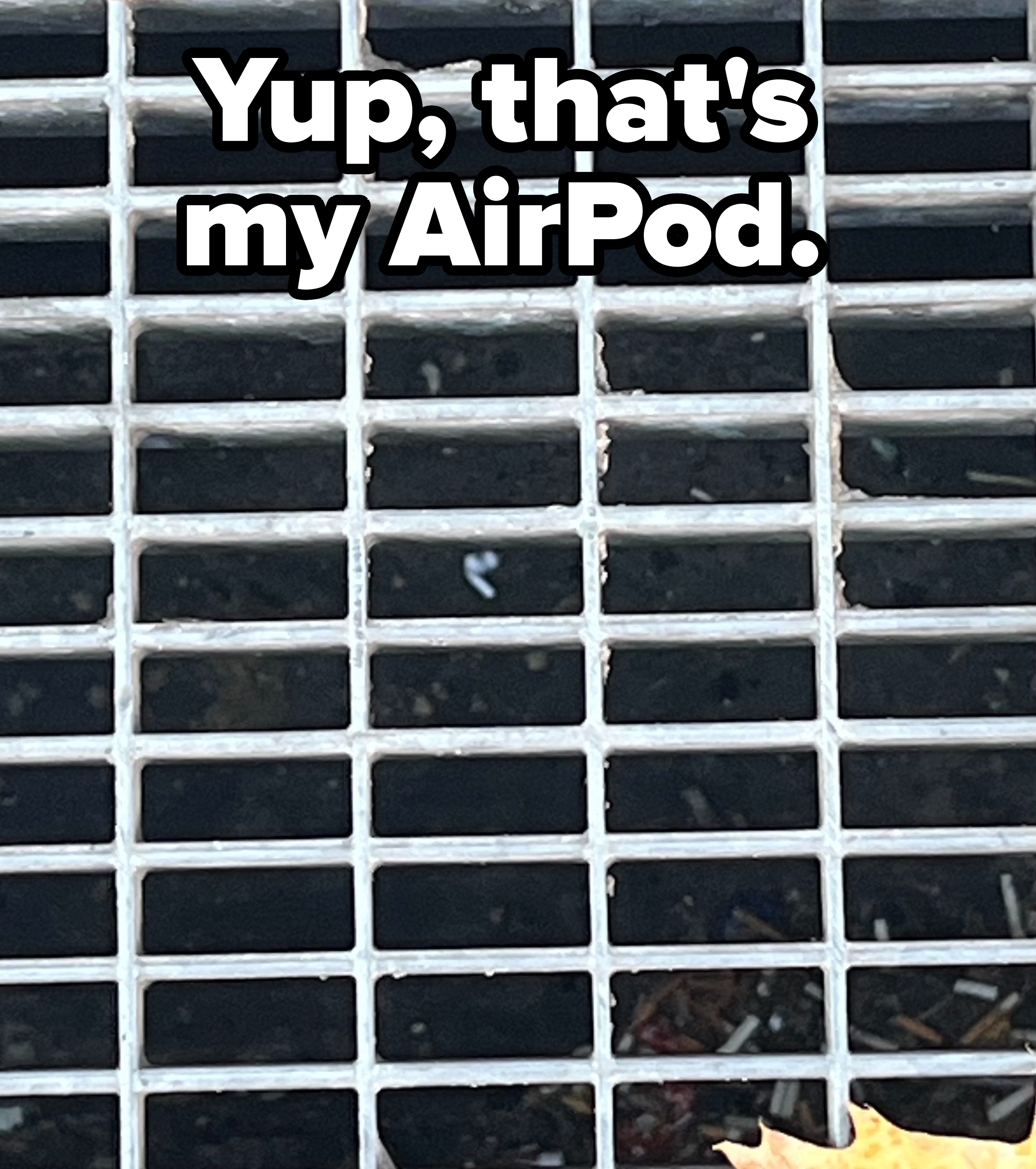 an AirPod that&#x27;s fallen through a sewer grate