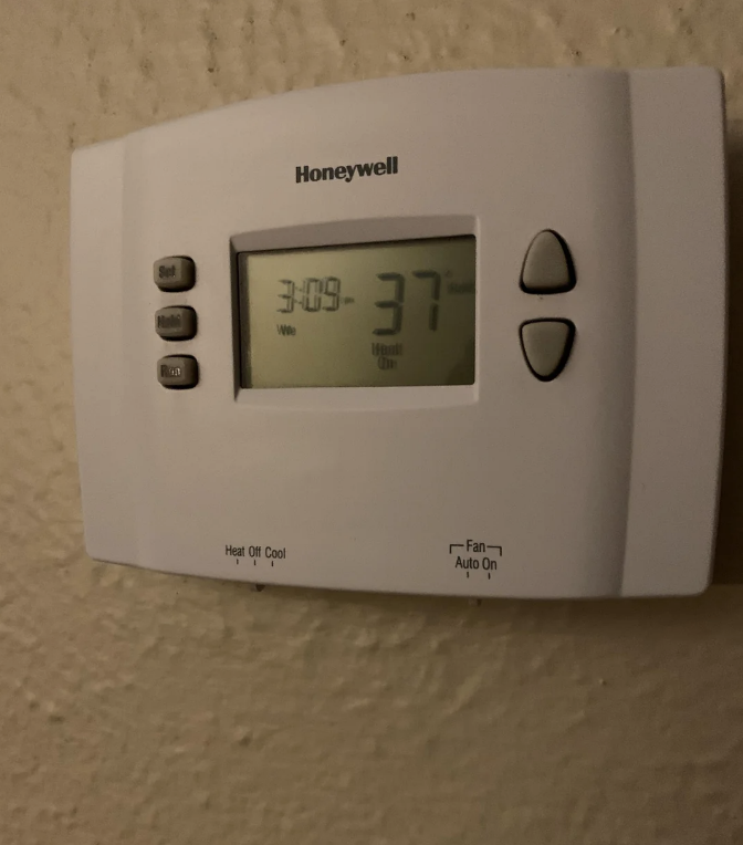 A thermostat set to 37 degrees