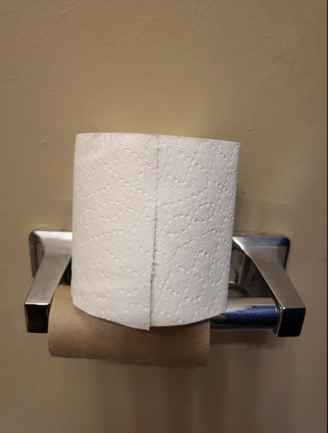 a toilet paper roll sitting on top of the holder