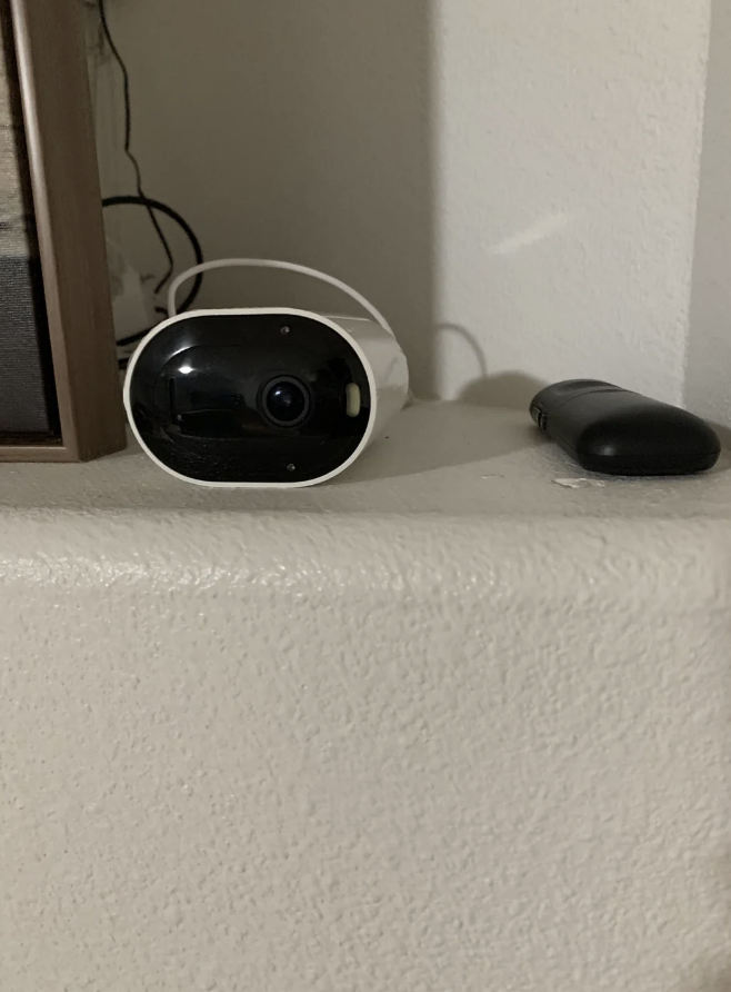 a camera on a shelf