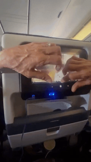 a person's hands blocking someone's screen