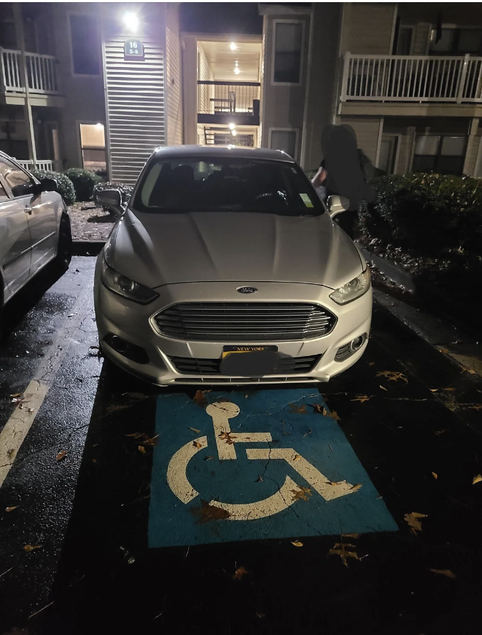 a car parked in a handicap spot