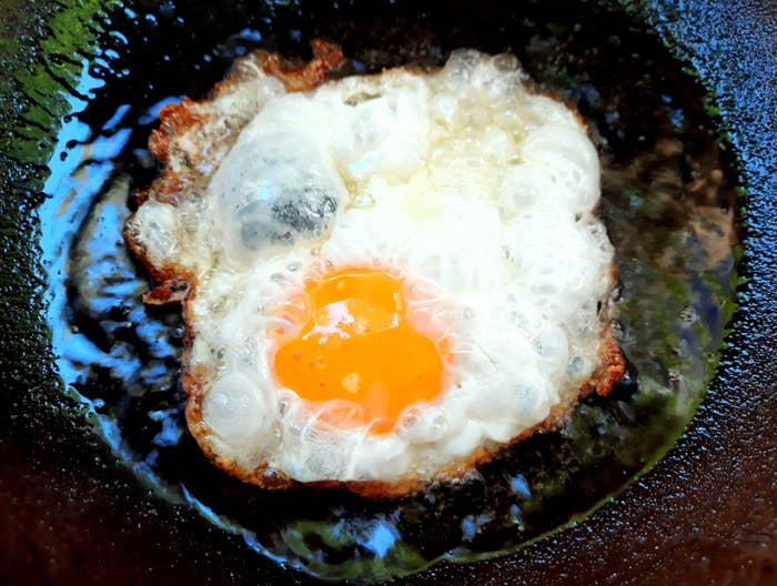 an egg frying in a pan