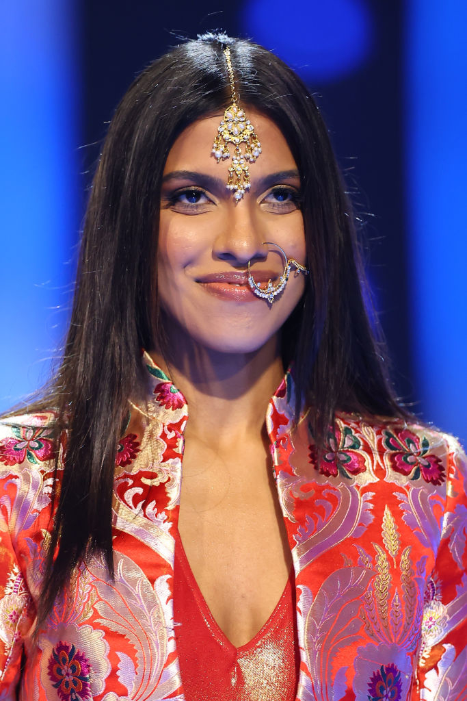 Close-up of her face jewelry, including a large hoop nose earring