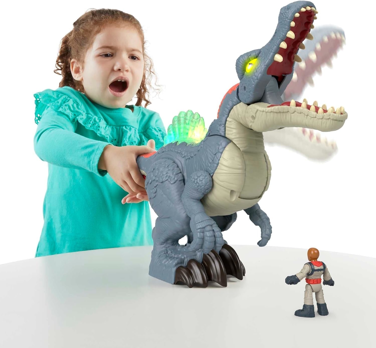 model child playing with the snapping dinosaur toy