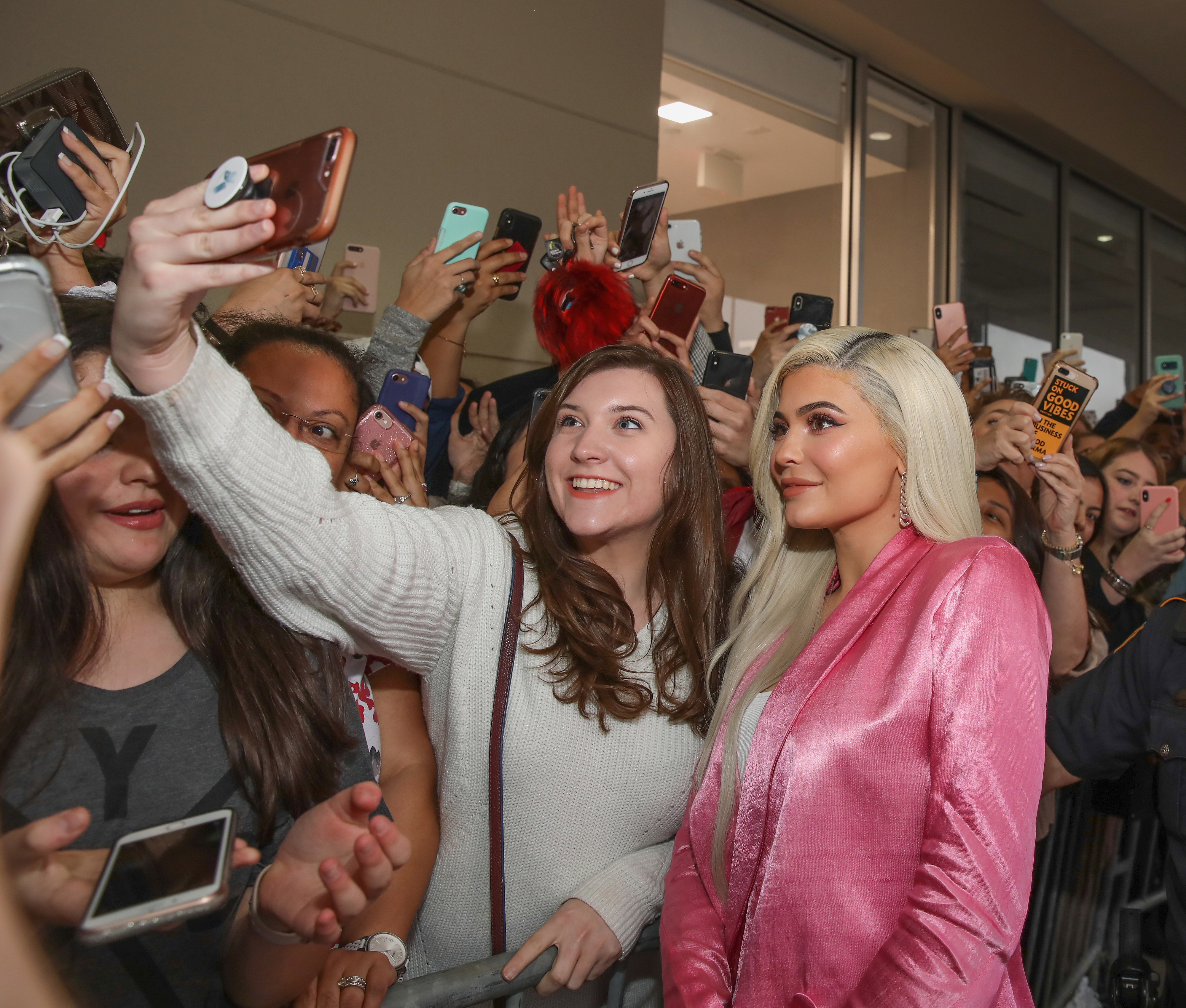 Kylie taking photos with fans