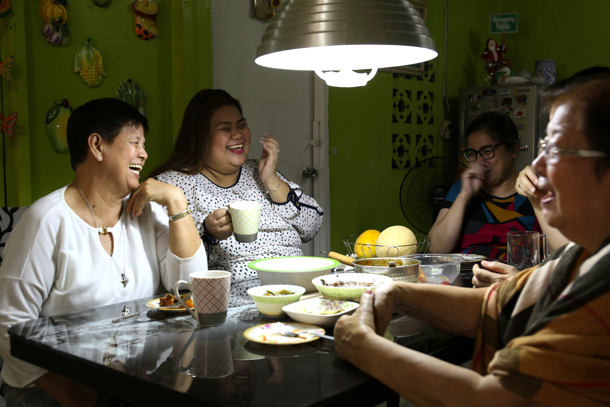 a family sharing a meal in the philippines