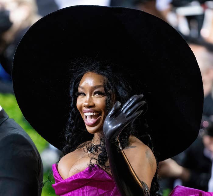 Closeup of SZA wearing a wide-brimed hat