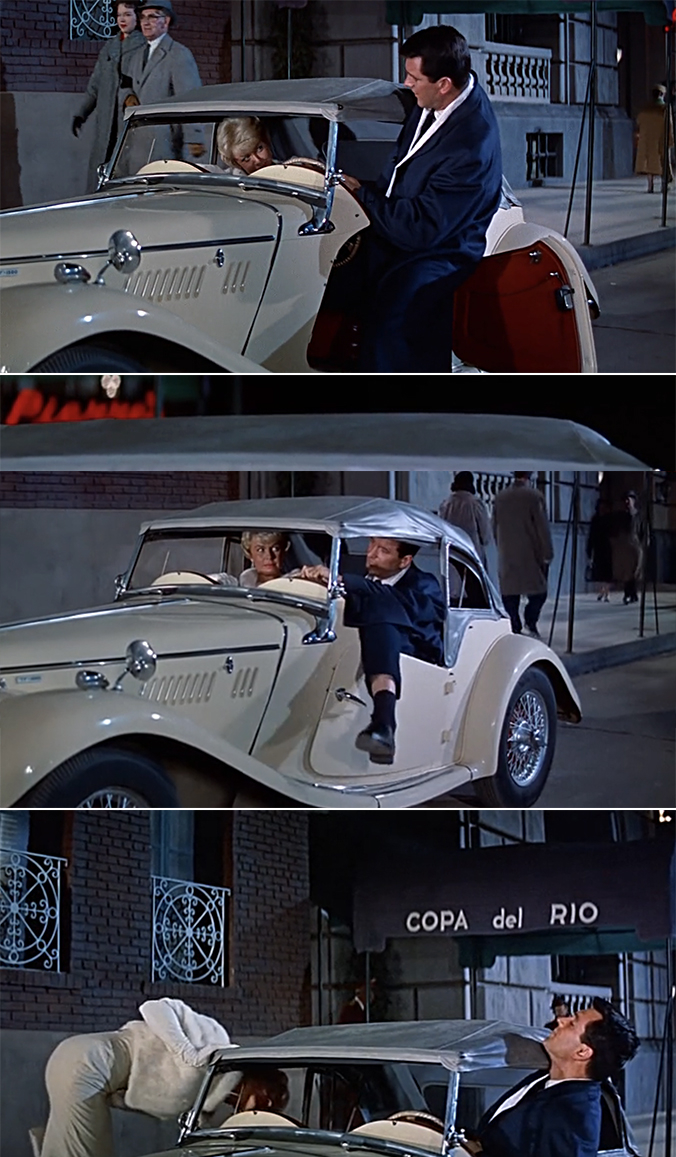 Rock Hudson trying to cram into a car with Doris Day, but he&#x27;s so big that he has to hang his leg out the window