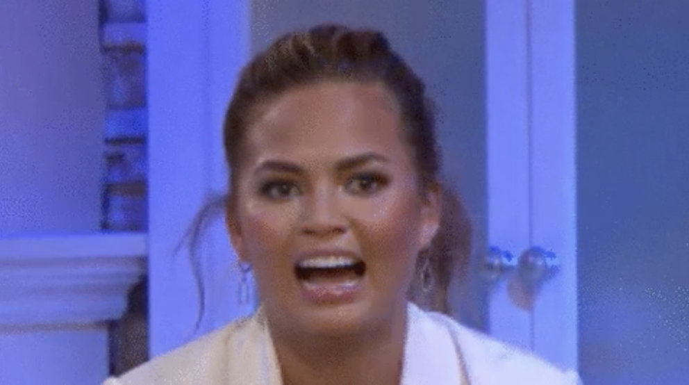 Closeup of Chrissy Teigen with a surprised face