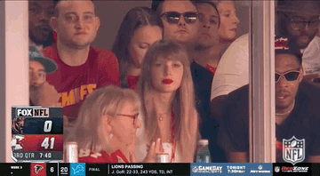 Taylor Swift looks in shock and then CHEERS!