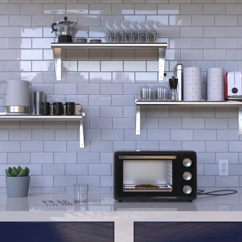 shelves mounted to wall holding kitchen accessories like glasses, toaster, and coffee pot