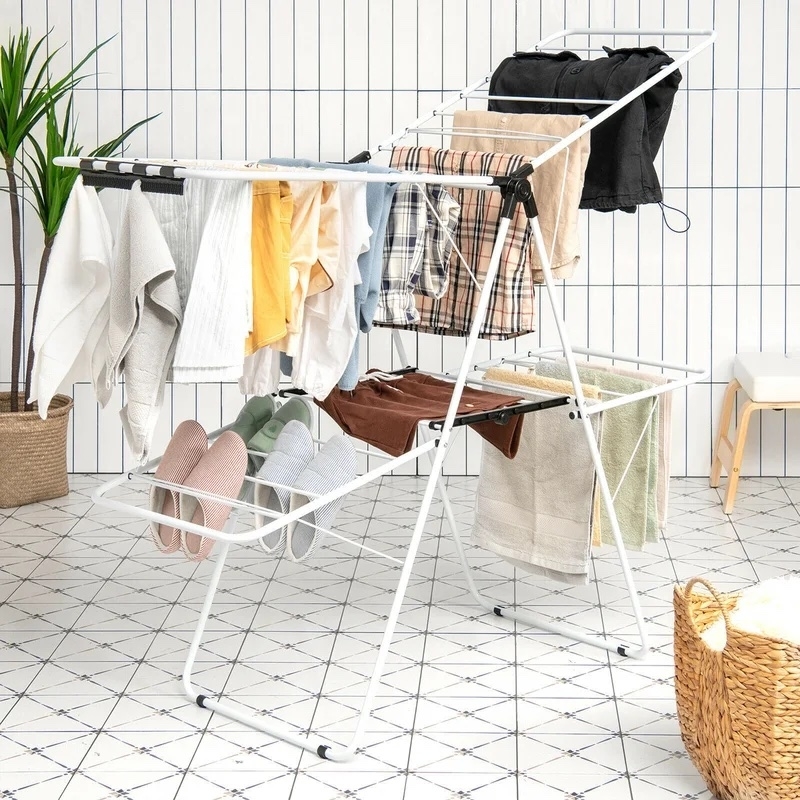 drying rack holding various clothes and shoes