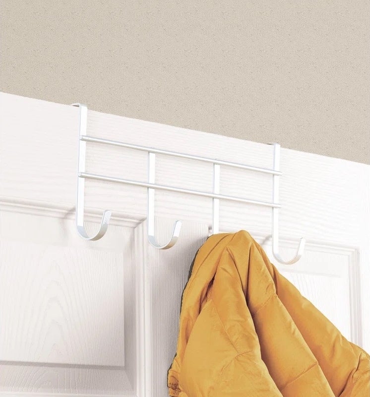 hooks on door with coat hanging