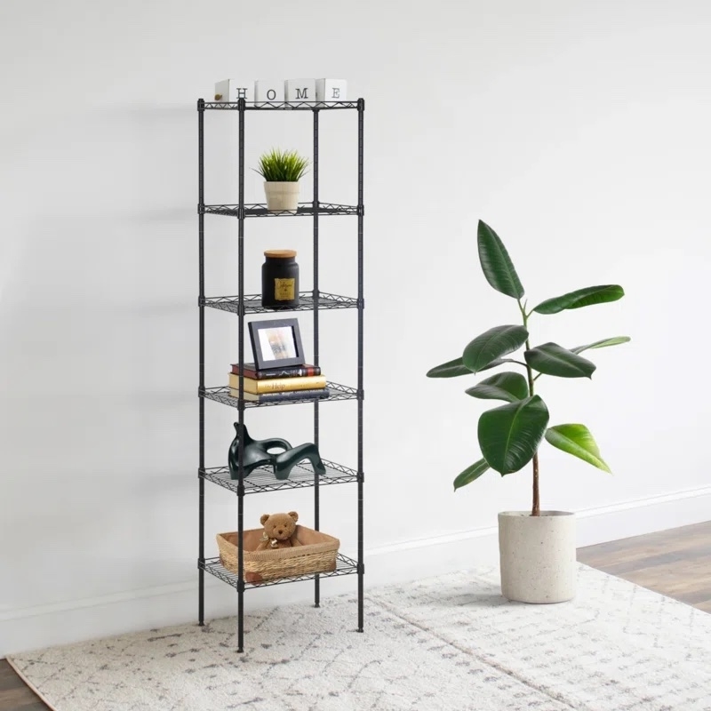 shelving unit holding various accessories like candle and plant