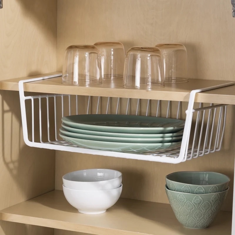 basket attached to cabinet shelf and holding multiple plates