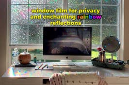 reviewer's work desk with the window film applied to the window above it and rainbows cast across the desk "window film for privacy and enchanting rainbow reflections" 