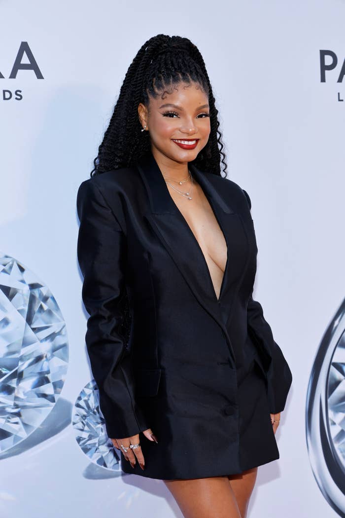 Closeup of Halle Bailey on the red carpet in a suit dress