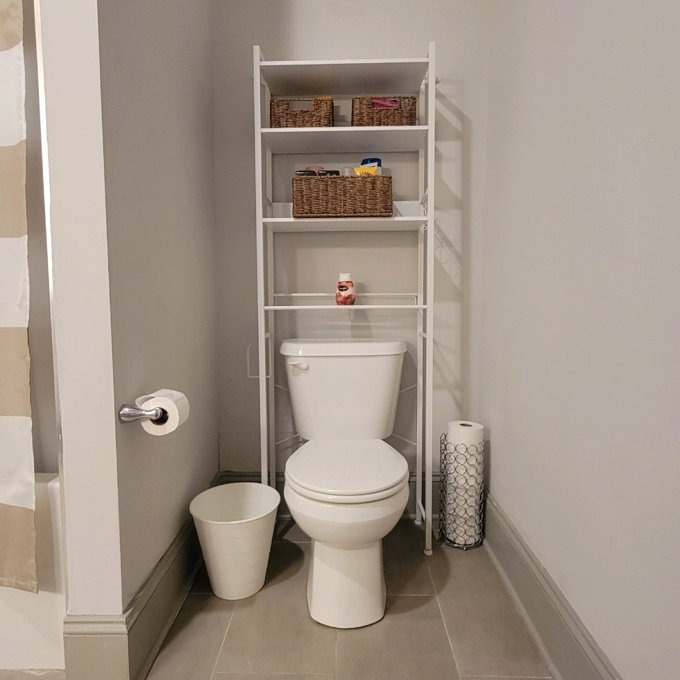reviewer image of the white toilet storage in their bathroom