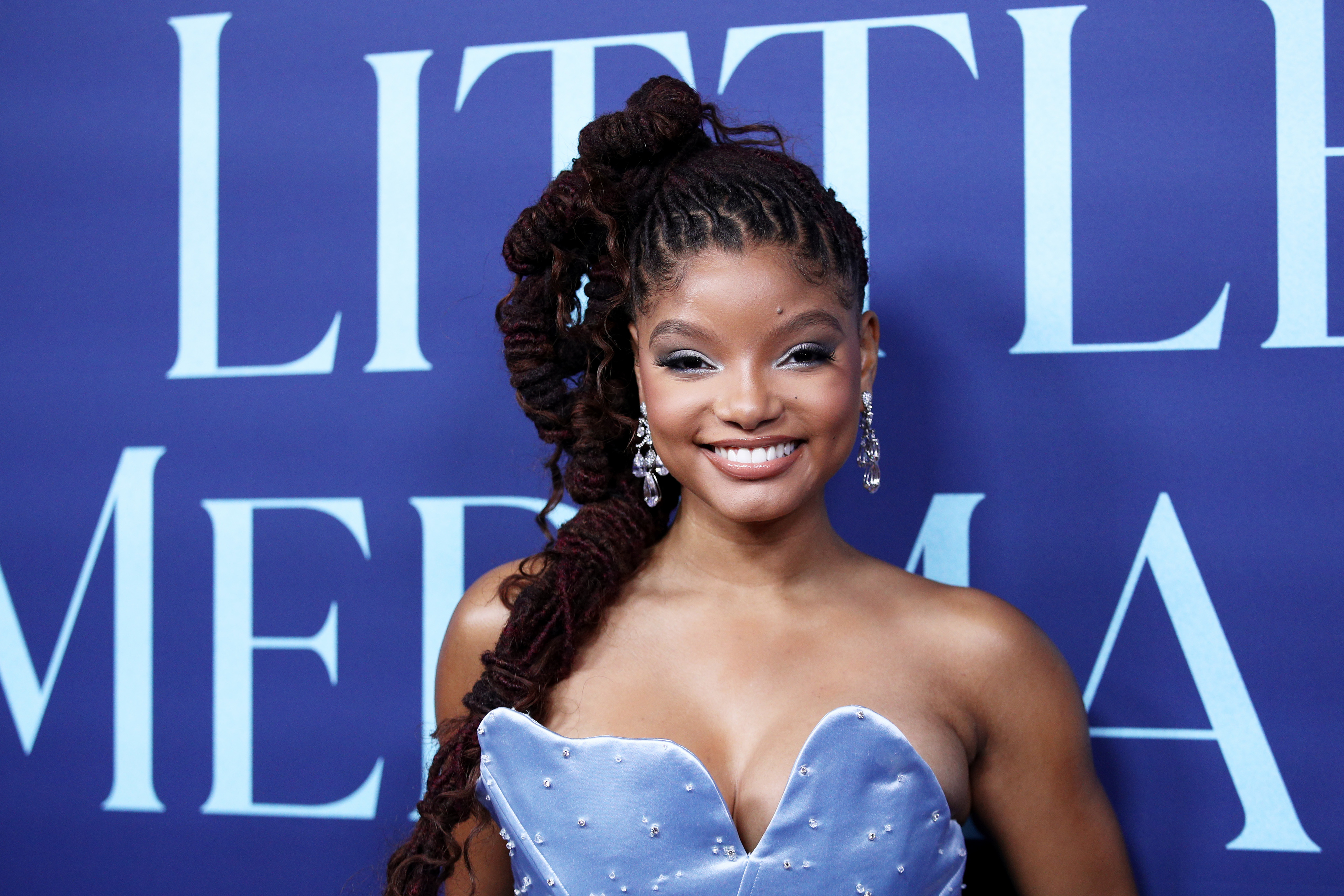 Closeup of Halle Bailey smiling on the red carpet