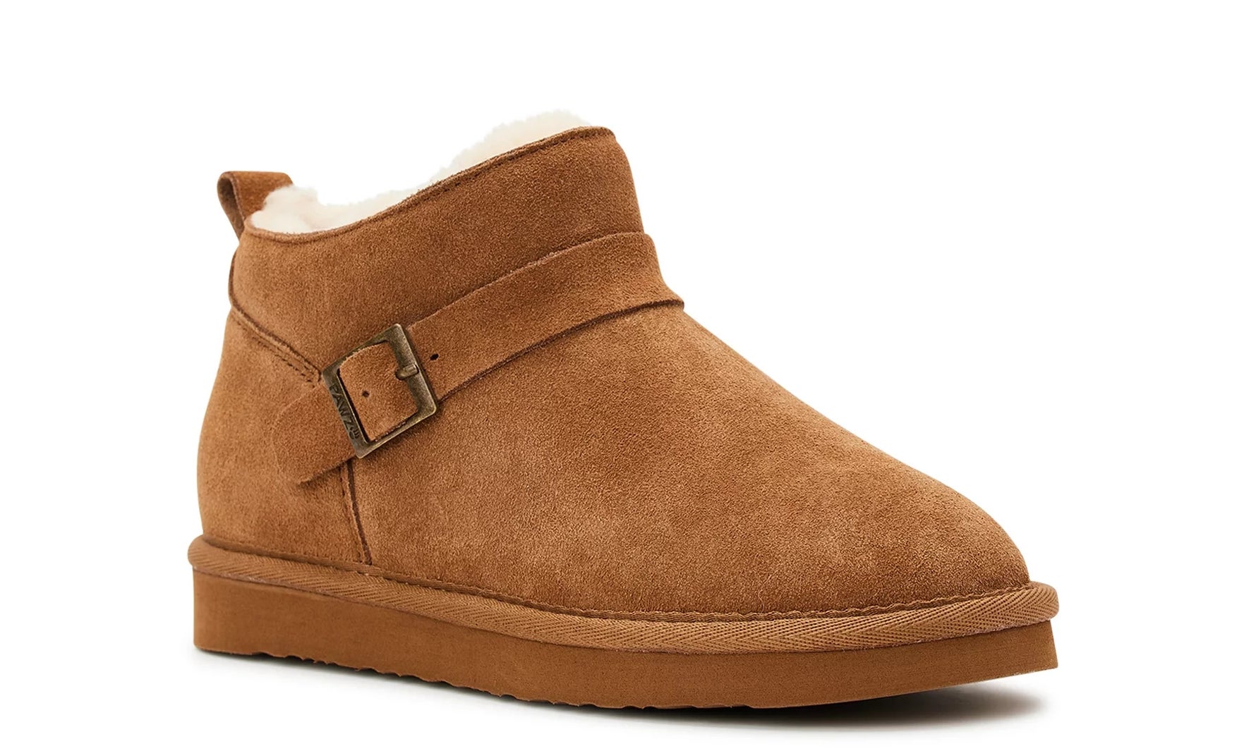 The boots in tan with white wool lining and a buckle detail on the side