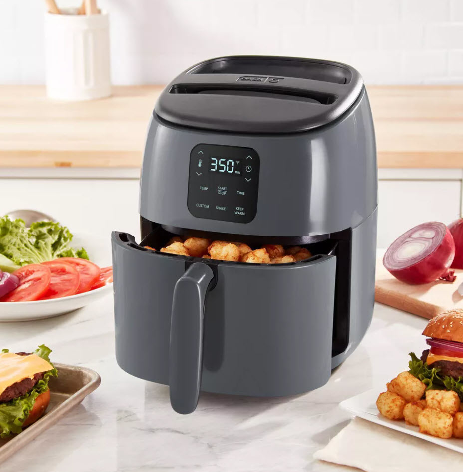 grey air fryer cooking tater tots on kitchen counter
