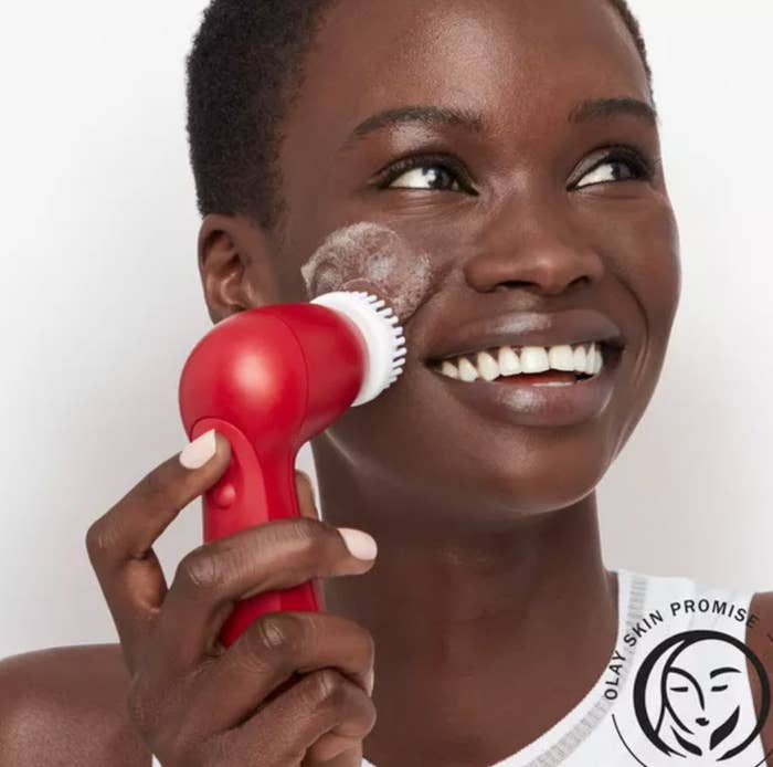 model using red facial cleansing device