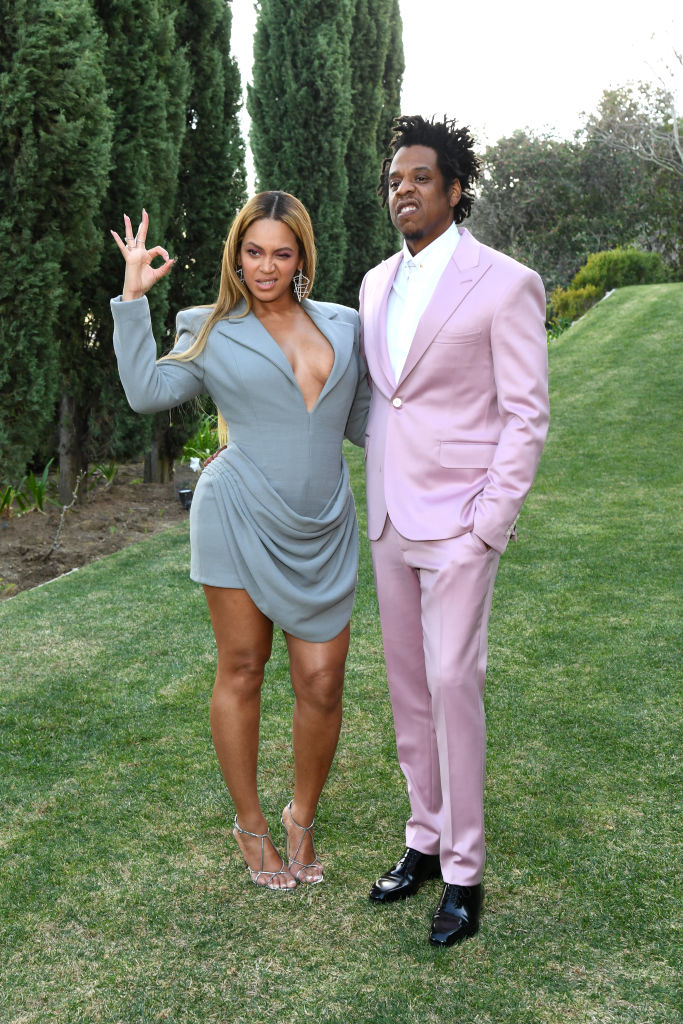 her and jay z posing in the grass