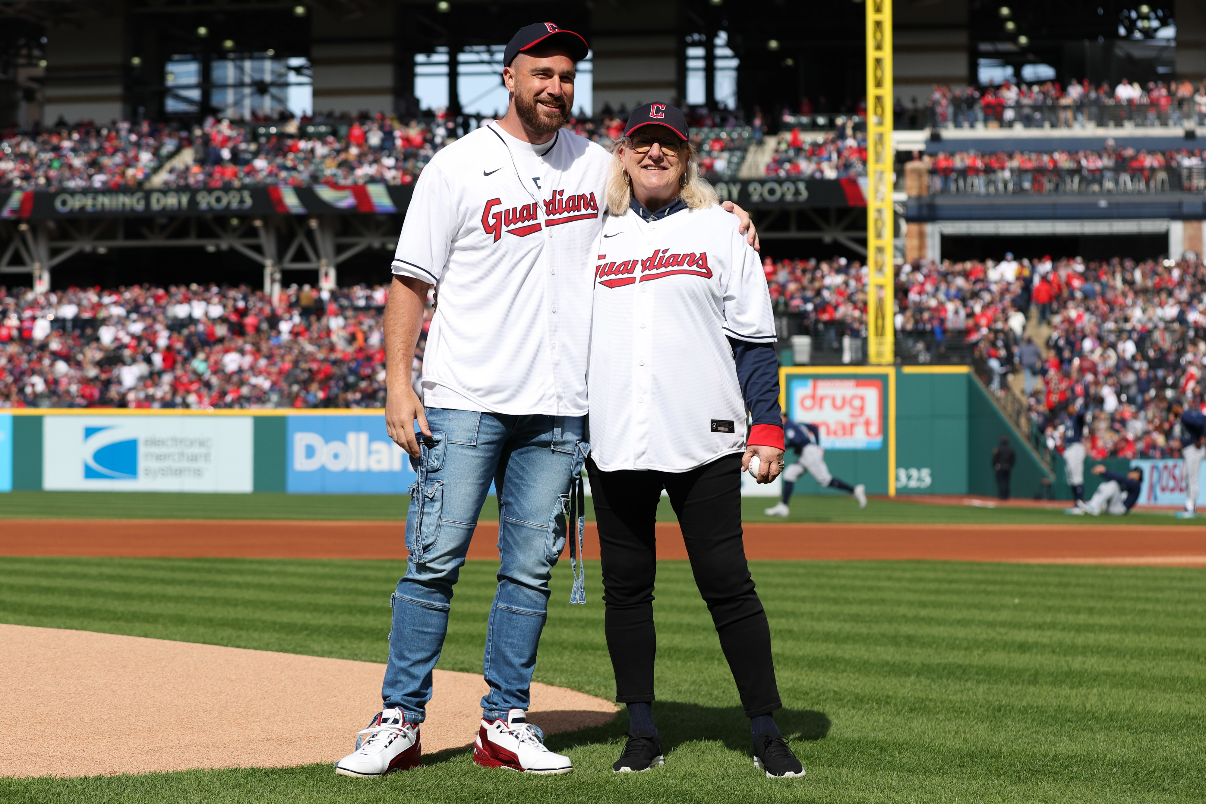 Travis and Donna Kelce on the field at a baseball game
