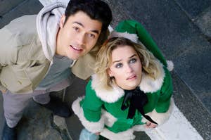 "LAST CHRISTMAS" Henry Golding and Emilia Clarke looking up.