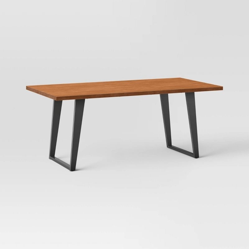 the wood table with black legs