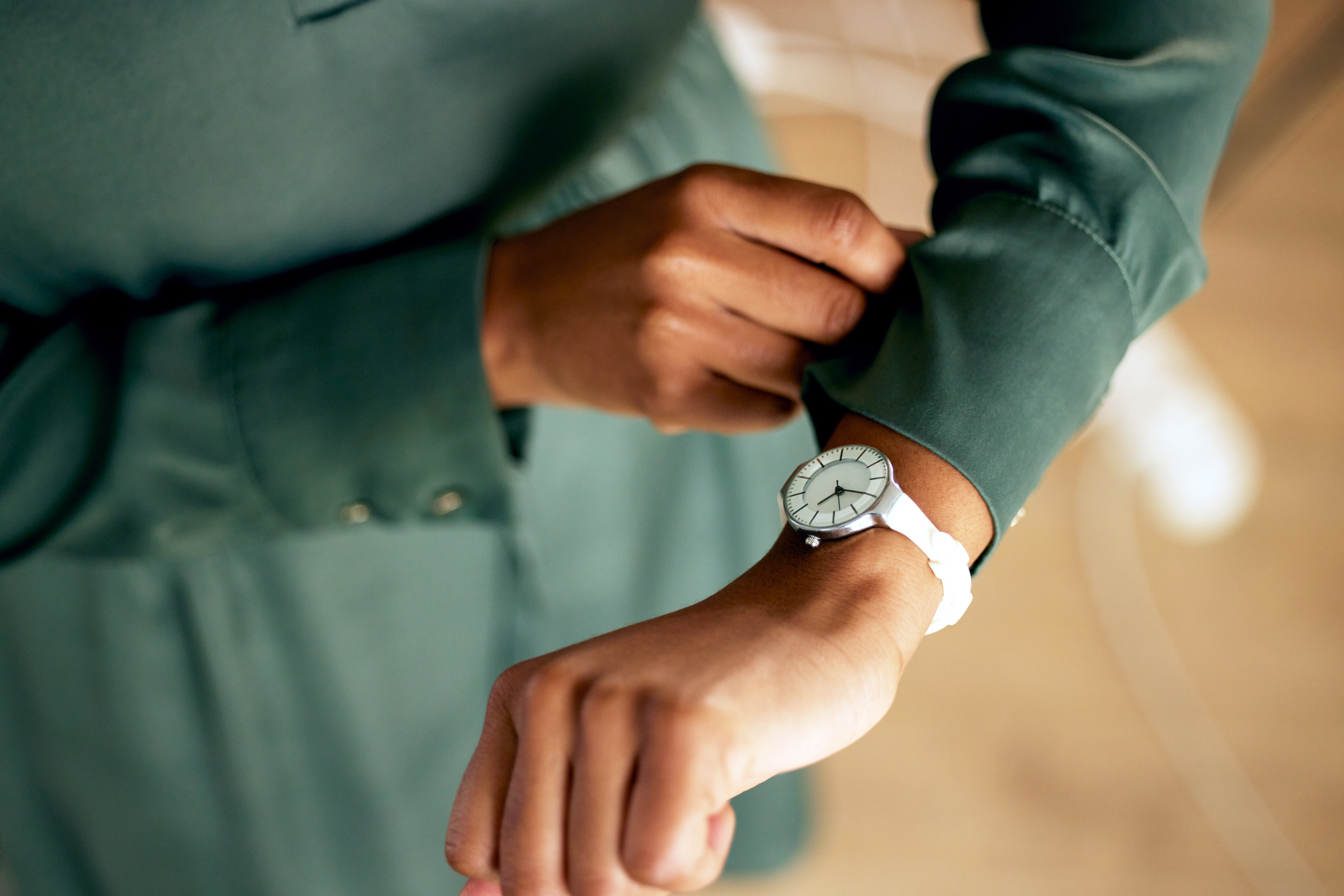 a person showing their watch