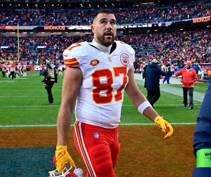 Travis Kelce walking off of the football field