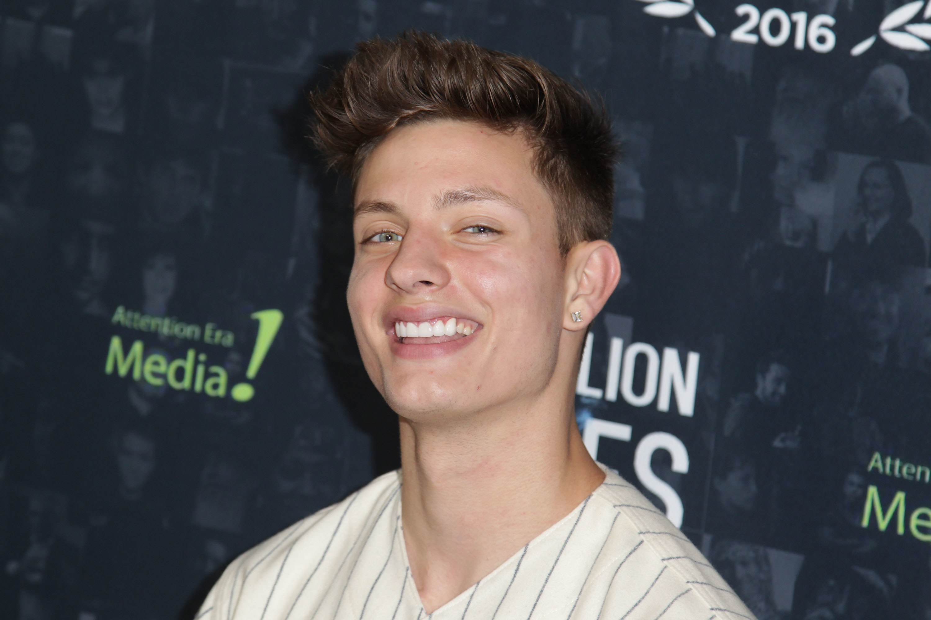 Closeup of Matt Rife smiling widely at an event