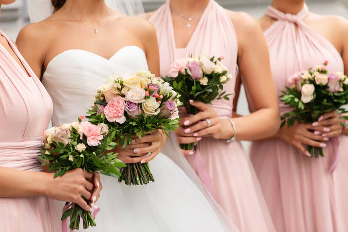 a bride standing with bridesmaids
