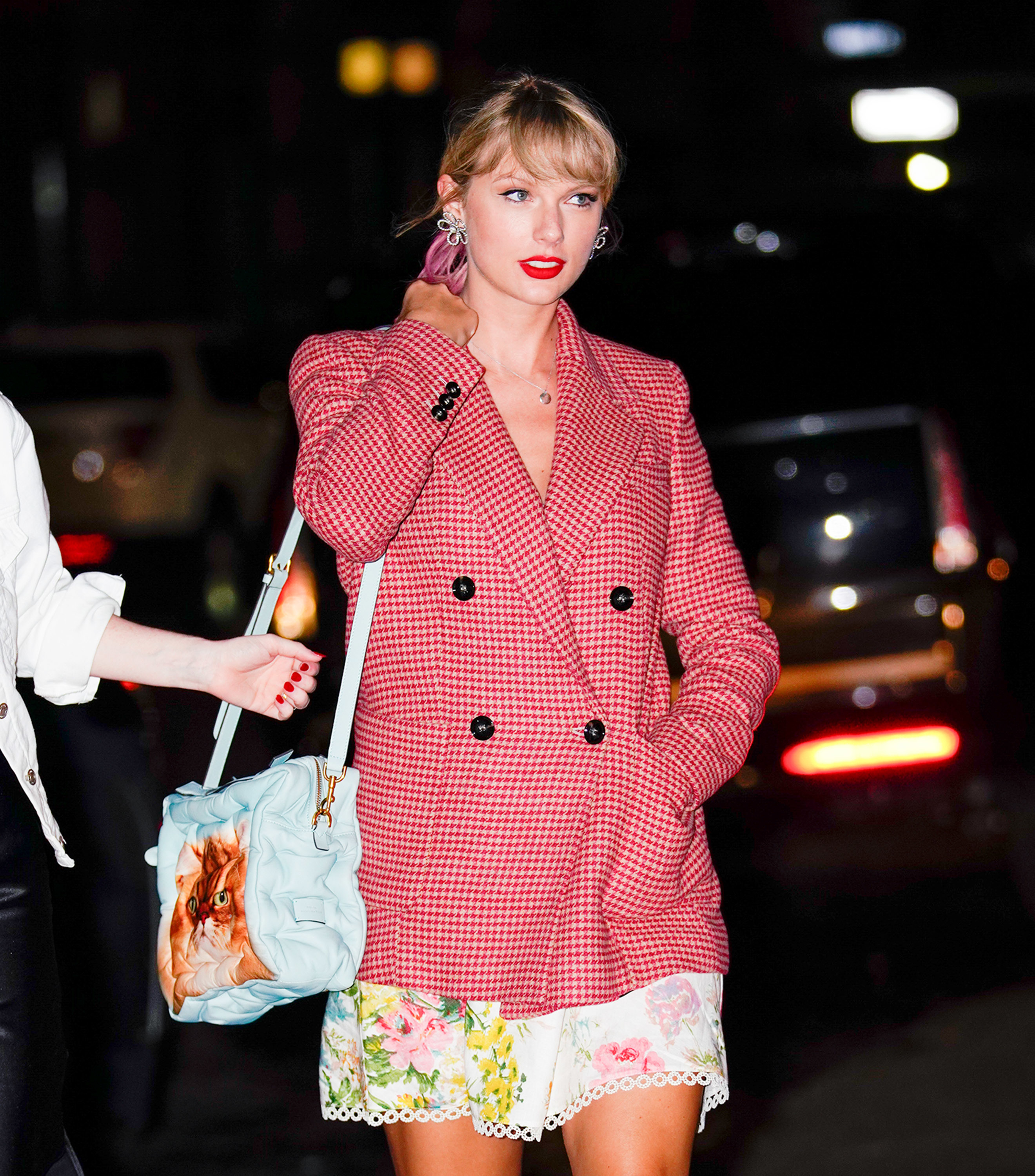 Closeup of Taylor Swift walking in a blazer and dress