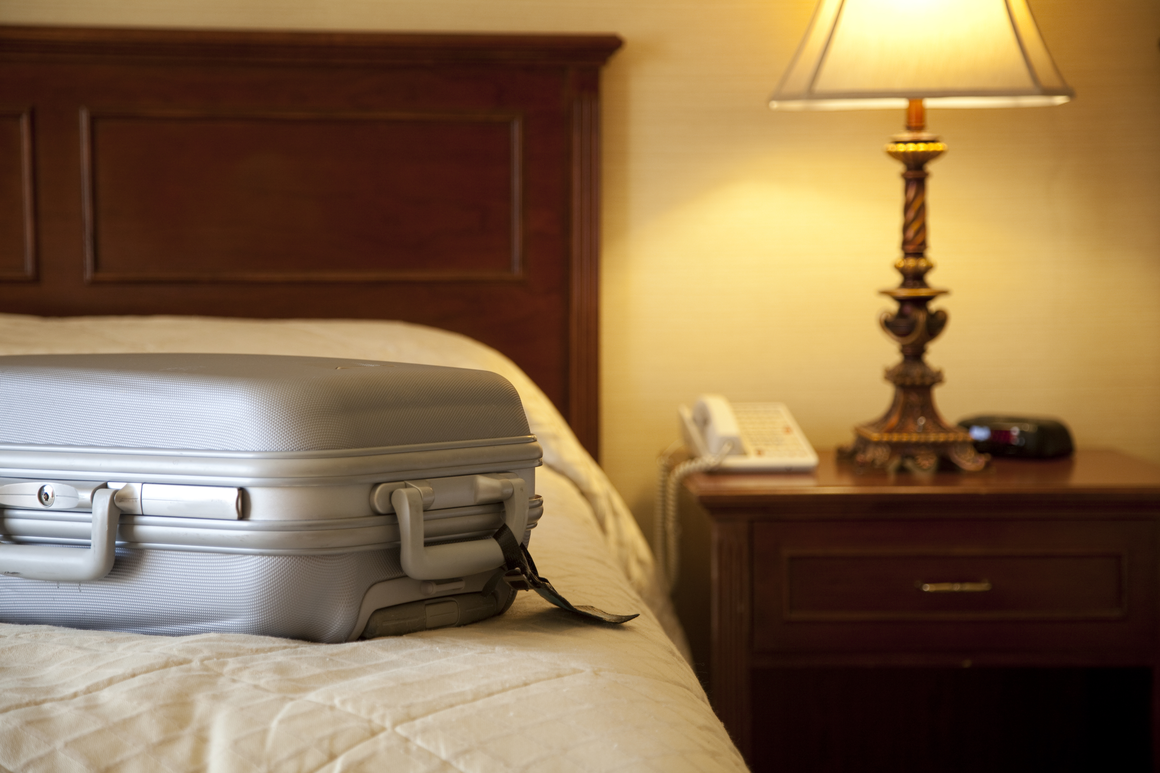 a suitcase on top of a bed