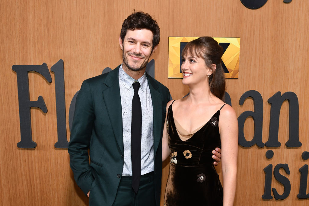 Closeup of Adam Brody and Leighton Meester at a media event