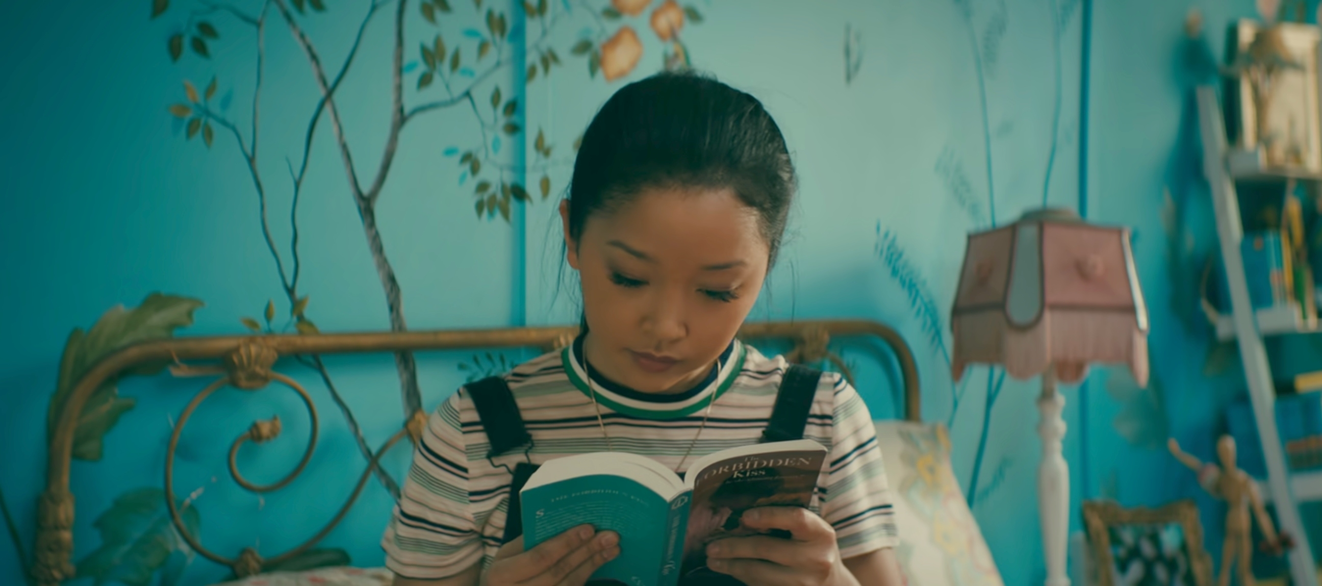 Lara Jean from &quot;To All The Boys I&#x27;ve Loved Before&quot; is reading a book