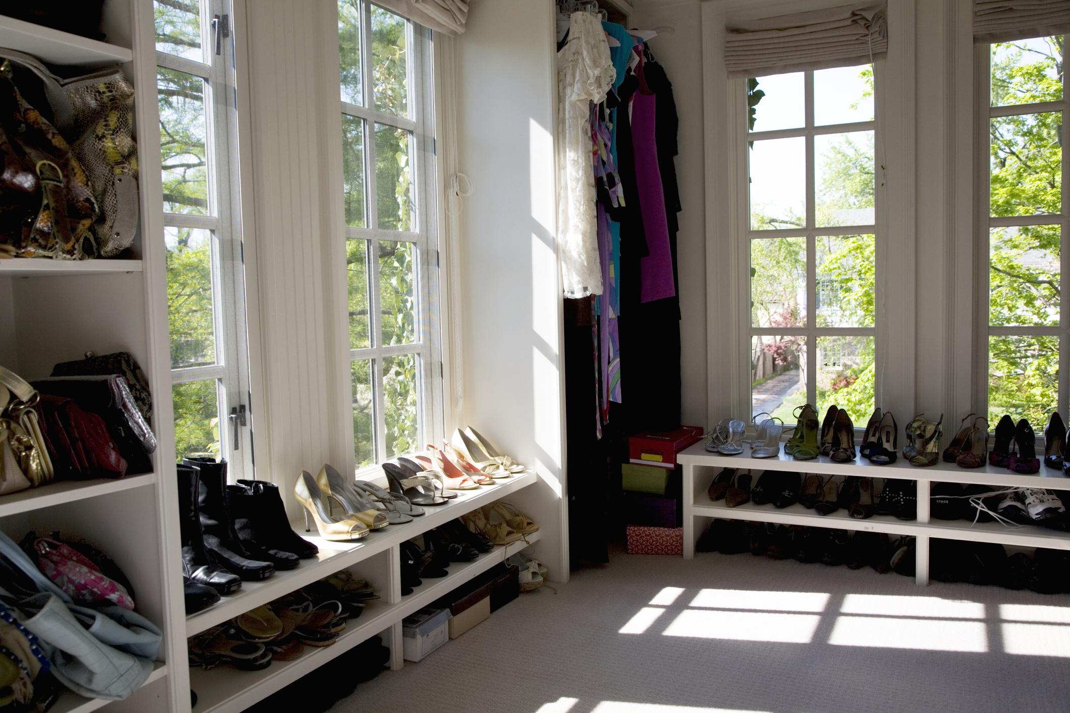 A room-size walk-in closet with windows
