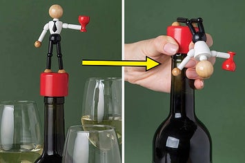 wine stopper featuring a figure that falls over when you press down