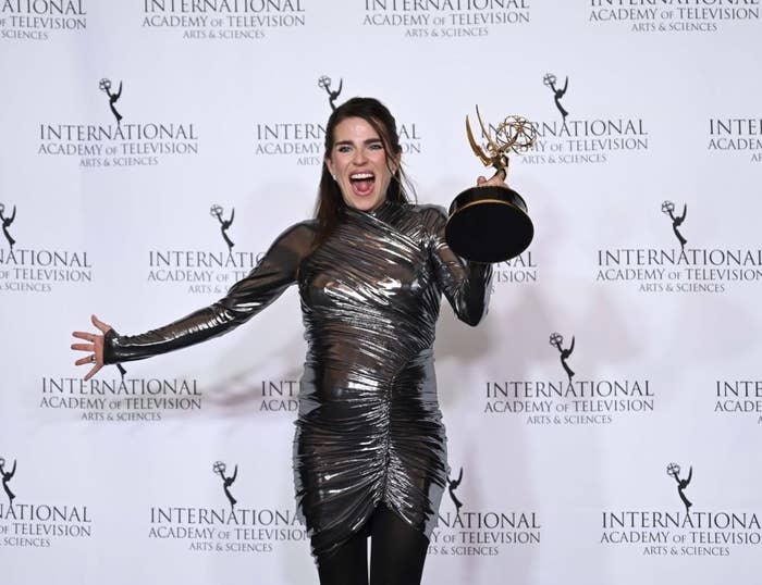 Karla Souza holding her Emmy Award