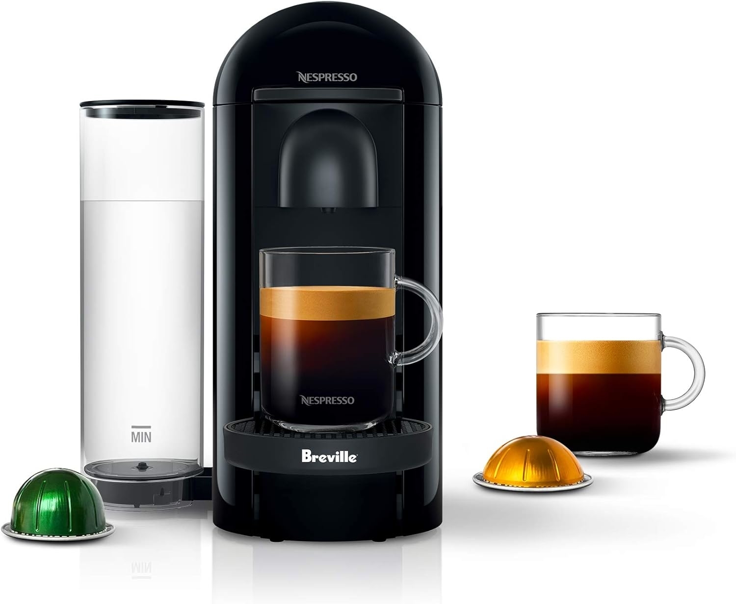 nespresso machine with two pods and a coffee