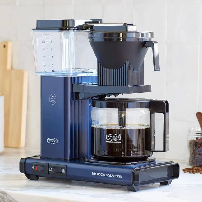 a dark blue moccamaster coffee machine