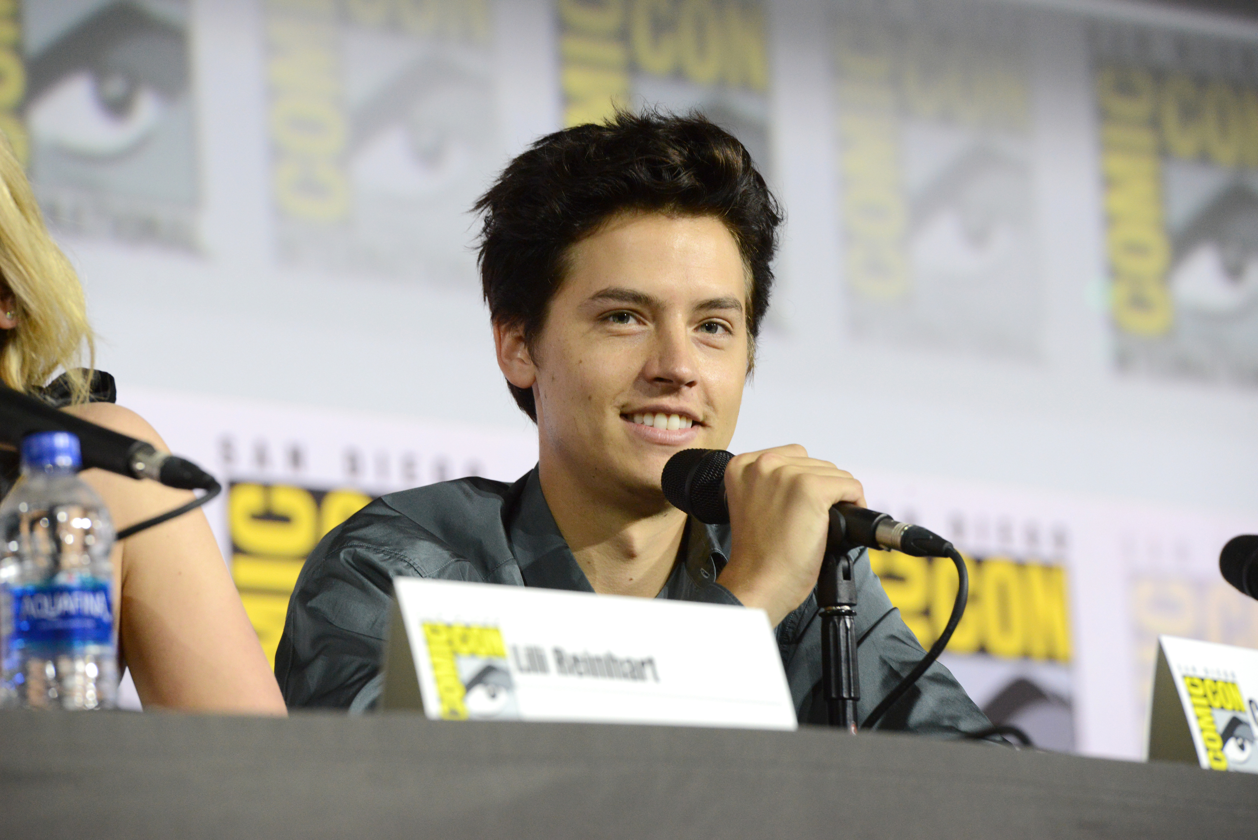 closeup of him at comic con speaking into a mic