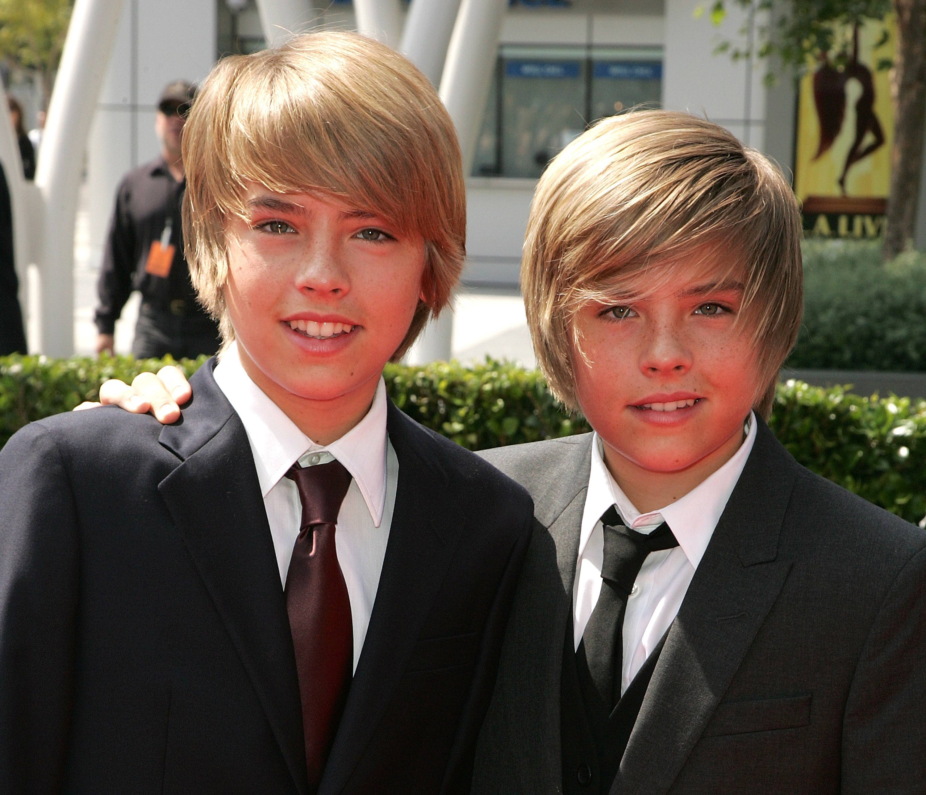 closeup of the twins in suits