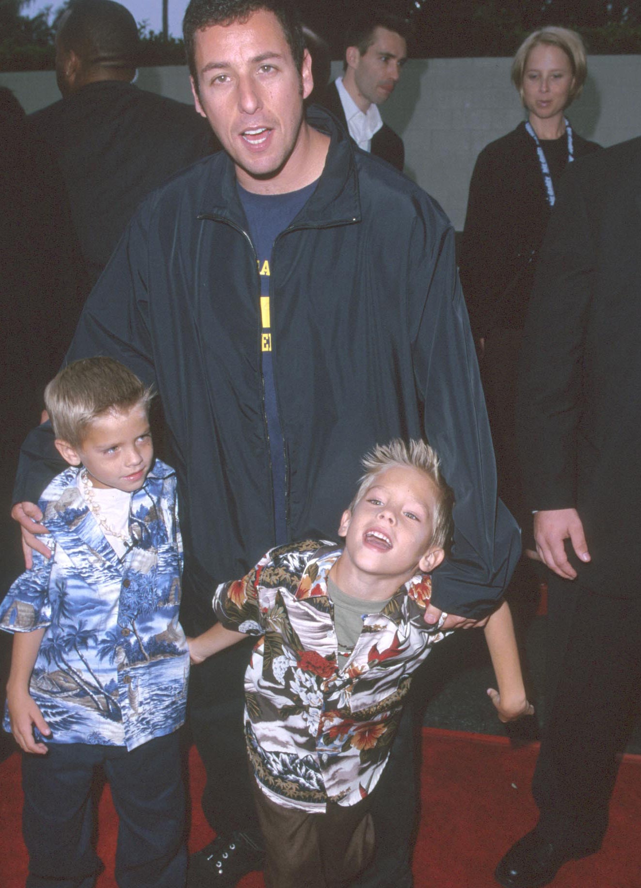 the young twins with adam on the red carpet