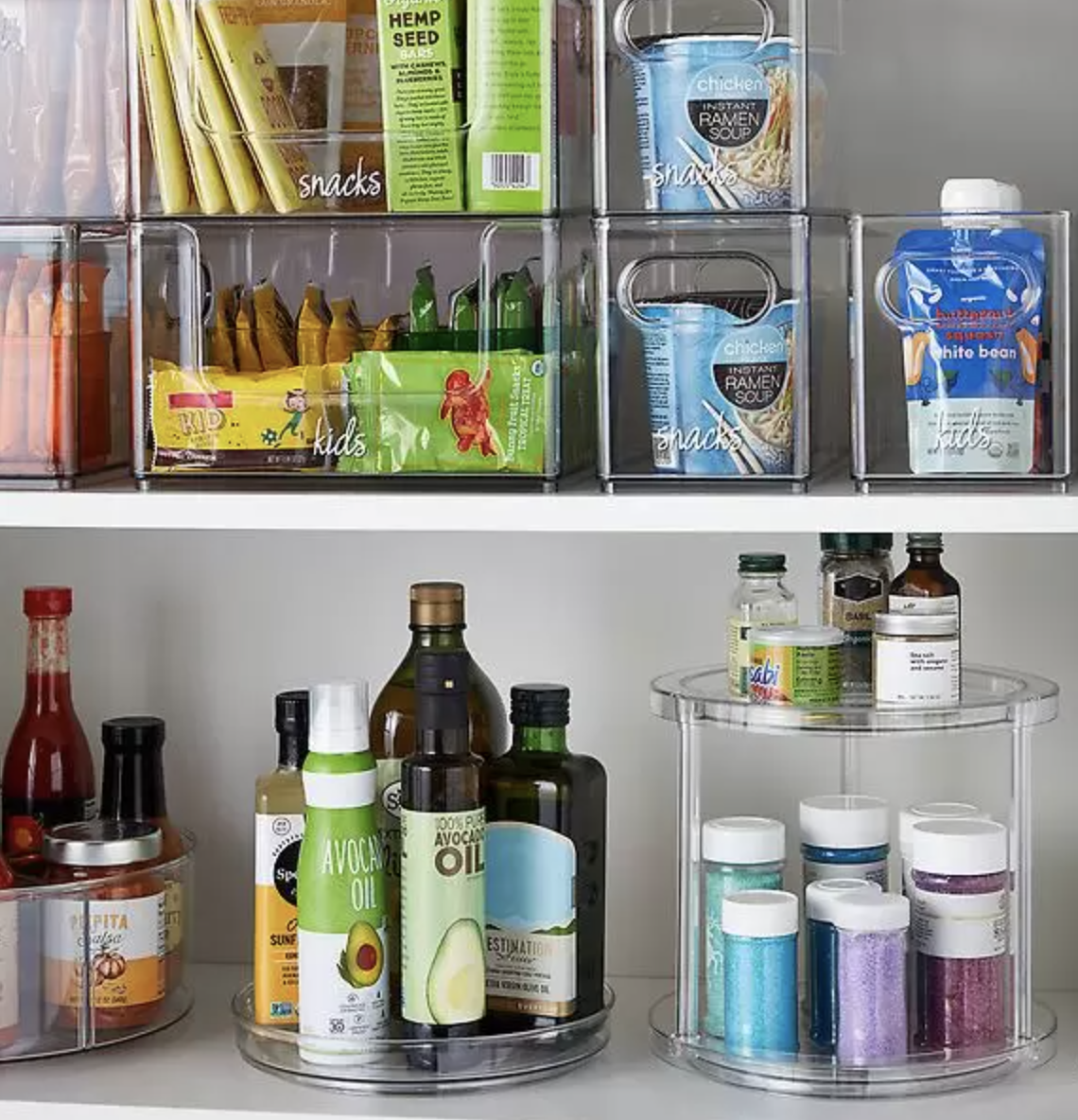 a pantry organized with clear acrylic bins