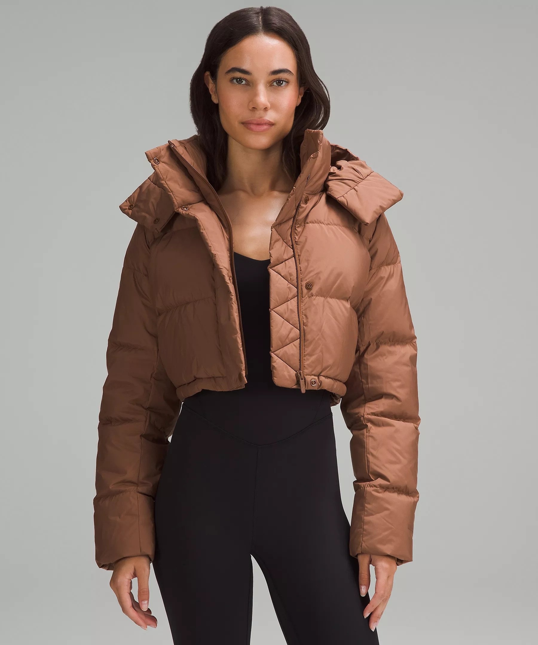 A model wearing the puffer in brown
